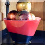 D51. Glass bowl and faux fruit.
